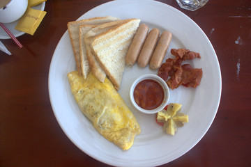 omelet with bacon sausages and bread