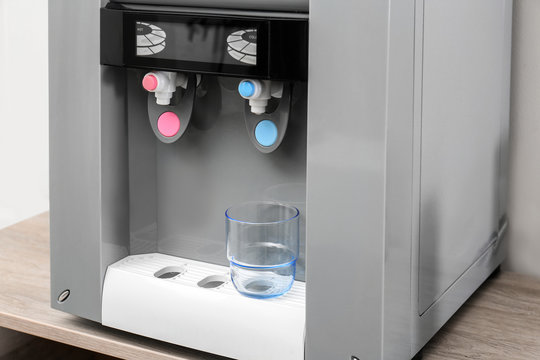 Office water cooler with glass, closeup