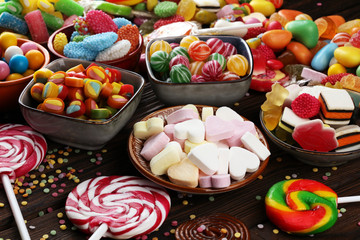 candies with jelly and sugar. colorful array of different childs sweets and treats.