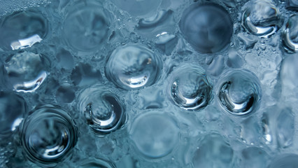 Abstract water bubbles on blue background