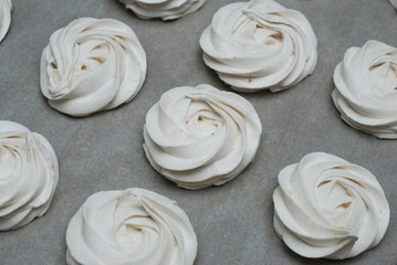 White Marshmallow, Meringue, Zephyr over Baking Paper ready for Drying. Step by Step process.