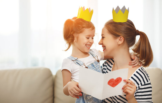 happy mother's day! mother and   daughter in crowns  and with postcard.