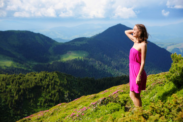The girl enjoys landscapes in the mountains of the Carpathians.