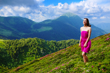 Naklejka na ściany i meble The girl enjoys landscapes in the mountains of the Carpathians.