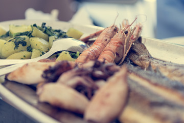 Plate of delicious grilled sea food.