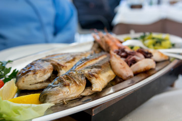 Plate of delicious grilled sea food.