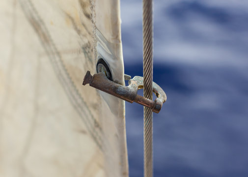 Jib hank (stags) on a forestay, heavely used. Holding a jib.