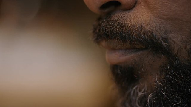 Close up of mature black male mouth talking during a conversation