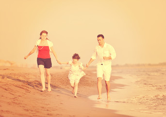 happy young family have fun on beach