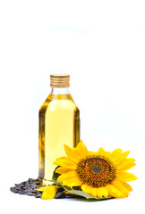 Sunflower with bottle of oil on a white background