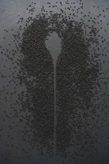 Obraz premium black sesame on wooden spoon