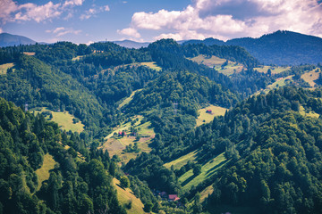 Fototapeta premium Stunning alpine landscape and green fields, Transylvania, Romania, Europe