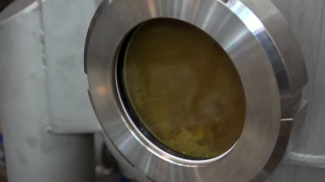 Modern Craft Brewery. Circulating beer with hop in the Hop Extractor (IPA production). 