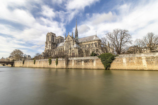 Long exposure photography of Notre Dame Cathedral from seine river - Paris