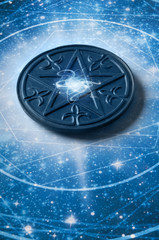 a magic pentagram lying in astrology starry blue background 