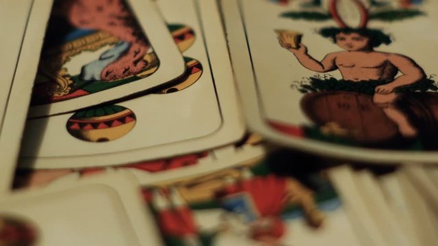 tracking shot on playing cards, gambling addiction