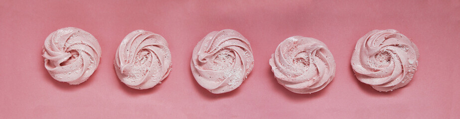 Pink Homemade Zephyr or Marshmallow on Pink Background. Strawberry Marshmallow, Meringue, Zephyr. Banner.
