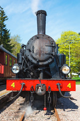Old steam locomotives on a station