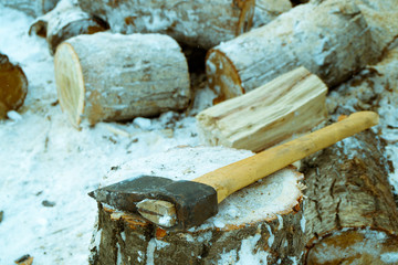 wooden chocks for firewood that need to split the cleaver on a stump, life in a Russian village in...