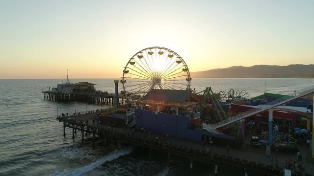 Aerial view of Ferris Wheel rotating at sunset