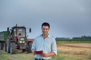 Farmer and tractor in field