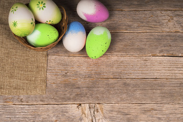 Colorfull Easter eggs on old wooden table