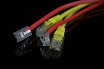Internet Access. Wires for internet connection on a black background. Reflection in black glass.