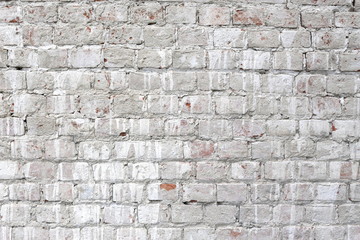 Beautiful abstract texture. An old brick wall in white paint.