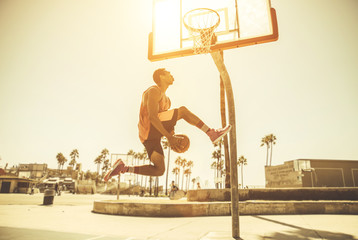 Basketball slam dunk on a californian court