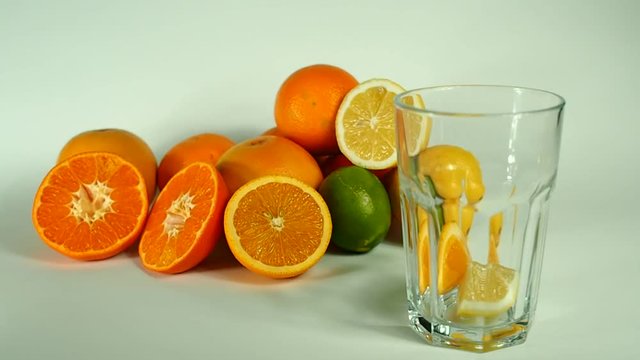 Preparation of lemonade, pile of fresh citrus fruits are ready to become ice cold summer drink.