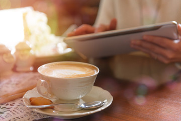 Woman using tablet in the cafe