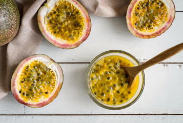 Passion fruit on white wooden background