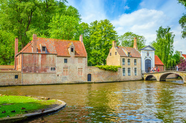 Naklejka na ściany i meble Beautiful canal and traditional houses in the old town of Bruges (Brugge), Belgium