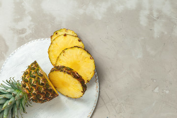 Fresh sliced pineapple on a cutting board