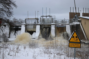 Small hydroelectric dam in southern sweden releases excess water