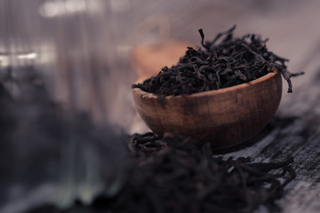 Black tea in a wooden spoon