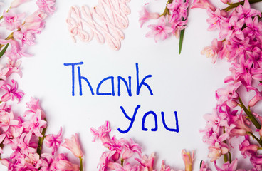 Obraz na płótnie Canvas Thank you note with hyacinth spring flowers arrangement