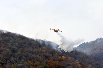 Varese, Campo dei Fiori, Italy, october/28/2017, Canadair in action on a wildfire
