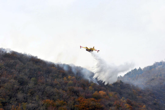 Varese, Campo dei Fiori, Italy, october/28/2017, Canadair in action on a wildfire
