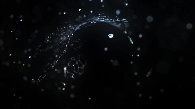 Water drops hits abstract dark object, slow motion 4k