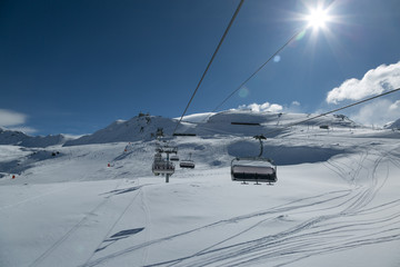 Lift system. Skiing in Alps. Perfect slopes