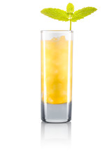 Yellow shot cocktail with mint and ice cubes isolated on white background. Clipping path