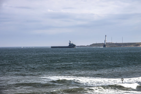 Ship entering harbour in Aberdeen, Scotland, UK. August 2015