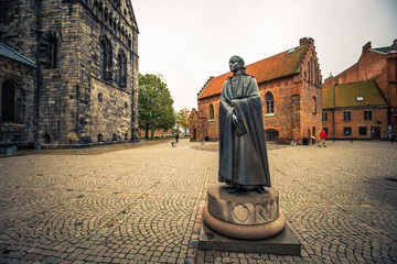 Lund - October 21, 2017: Statue near the gothic cathedral of Lund, Sweden