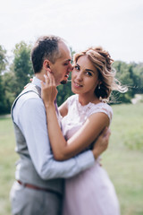 Fototapeta premium Walking newlyweds in nature.