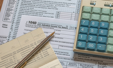 Tax day concept with tax paying preparation and USA    internal revenue service form