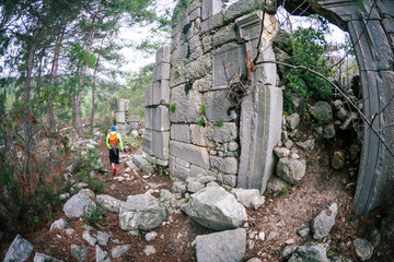 A man looks at ancient ruins.