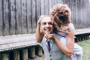 Newlyweds dance and have fun outdoors.