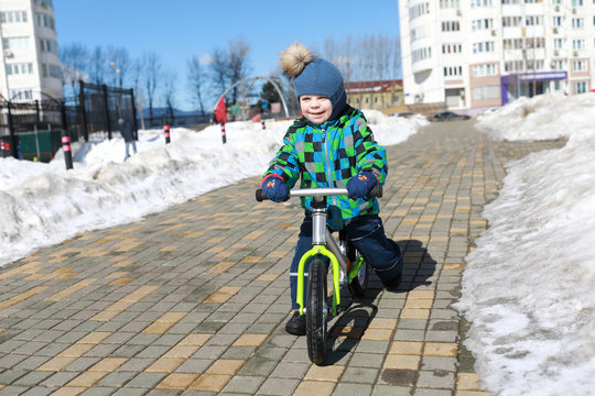 Child riding on balance bike