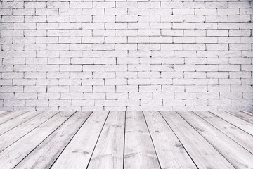 Room interior with white brick wall and wooden floor